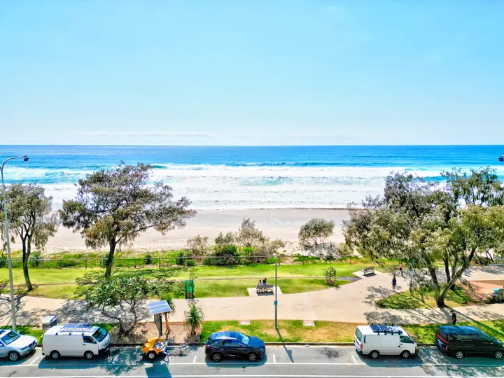 From the balcony: the foreshore park and the beach beyond