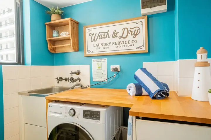 The laundry nook, with washer-dryer and sink