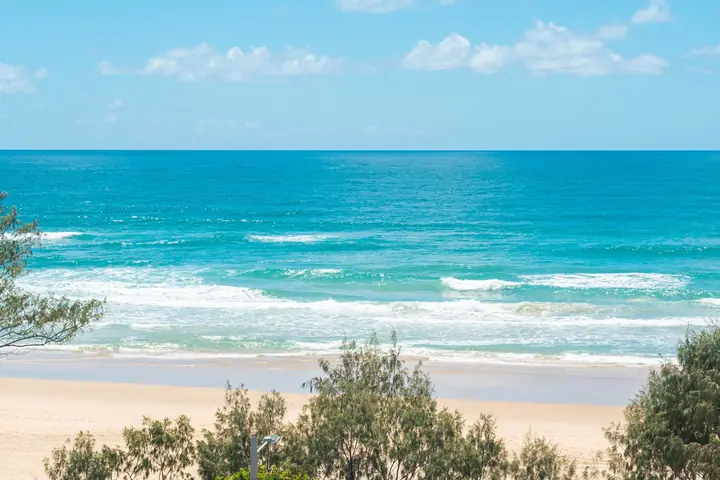 The outlook from the apartment: sand, surf and the Pacific