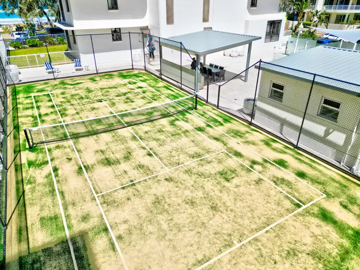 The tennis court, looking towards the beach